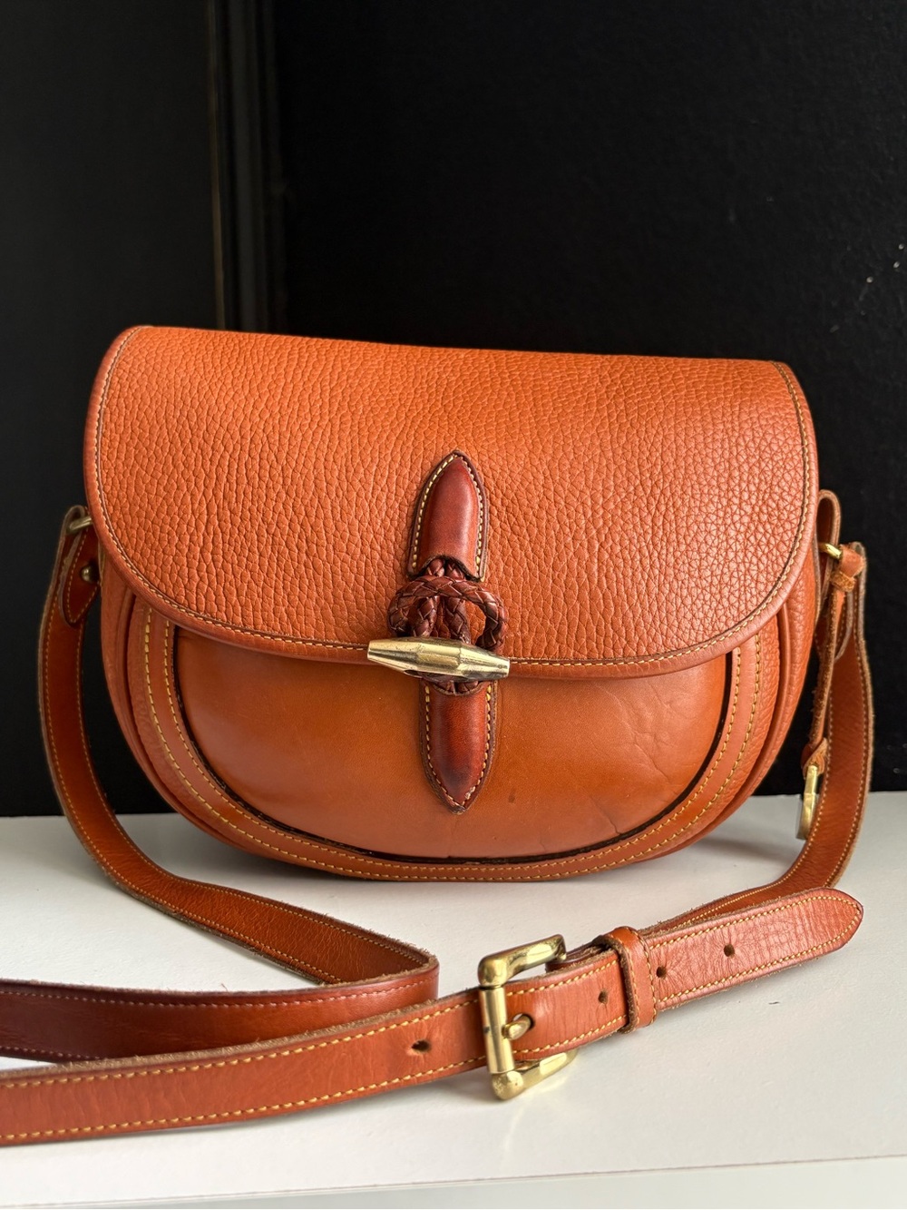 Dooney & Bourke awl Leather Outback Saddle Brass Toggle Bag
